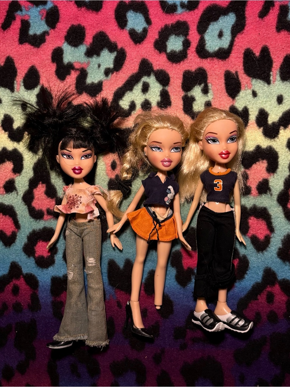 Three original Y2K Bratz Dolls with Trendy Outfits - Pink, Orange, Black